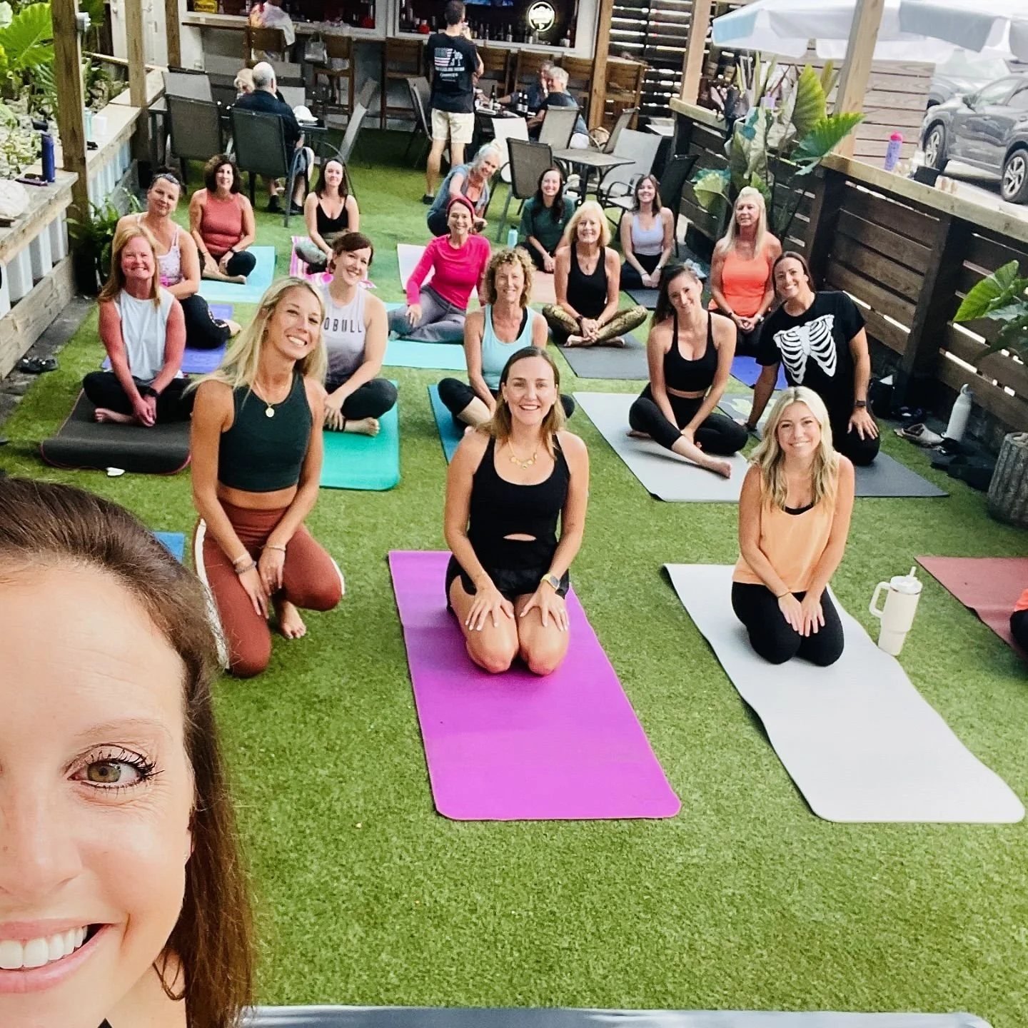 A group mat class on the lawn