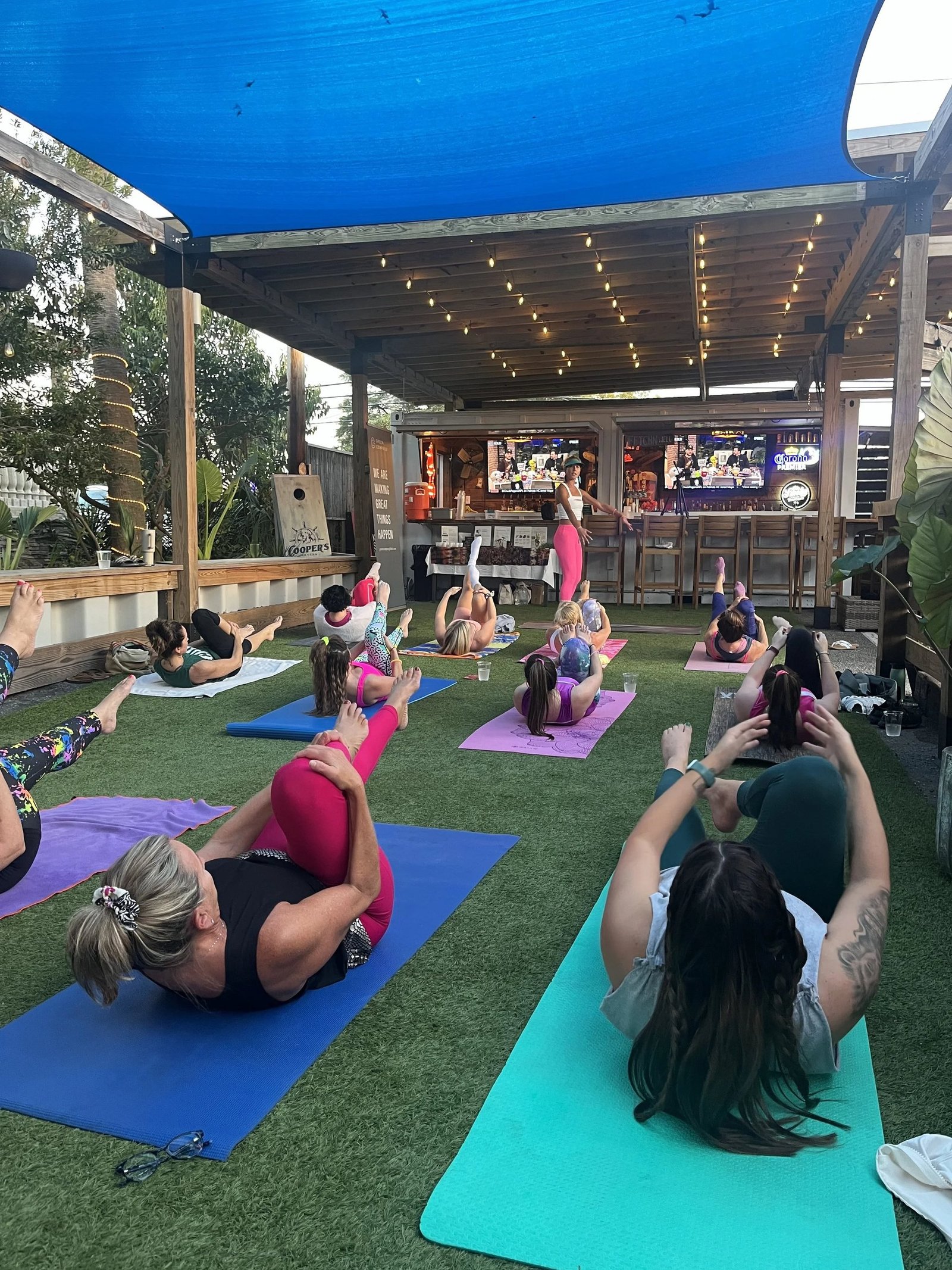 A pop-up mat class on a covered patio